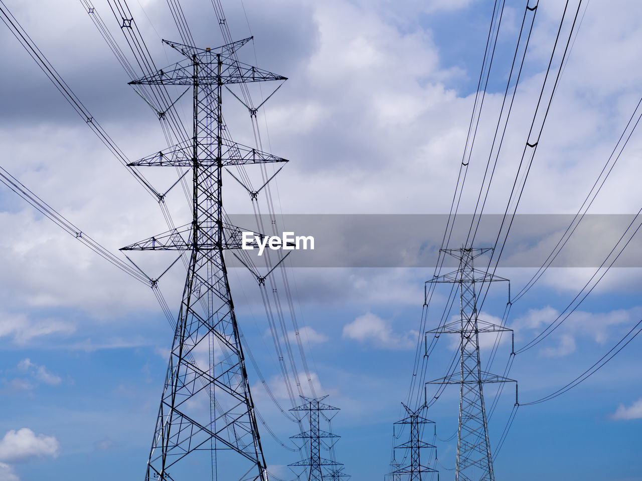 Low angle view of electricity pylon against sky