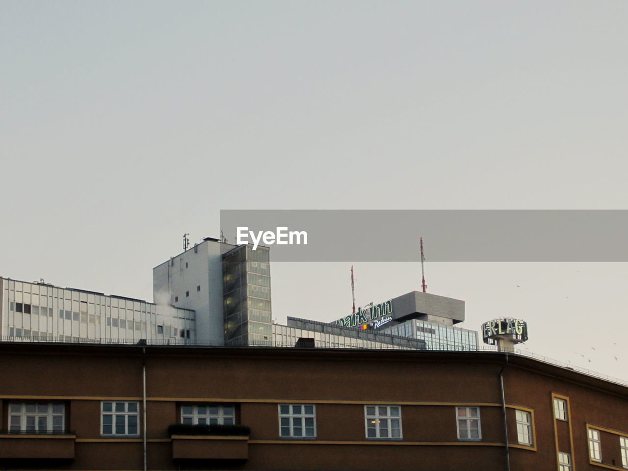 Low angle view of buildings against clear sky