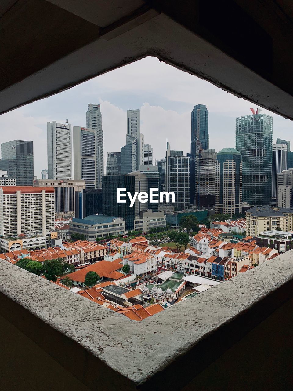 CITYSCAPE AGAINST SKY SEEN THROUGH CITY