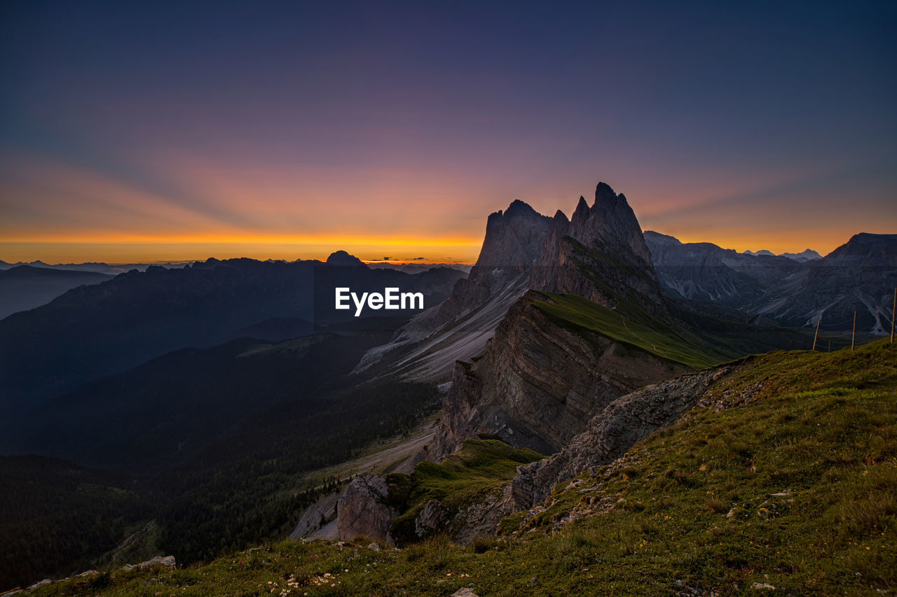 Seceda, dolomites - panoramic view of mountains during sunrise