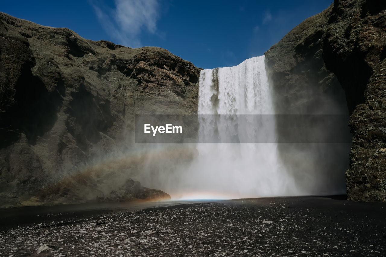 low angle view of waterfall