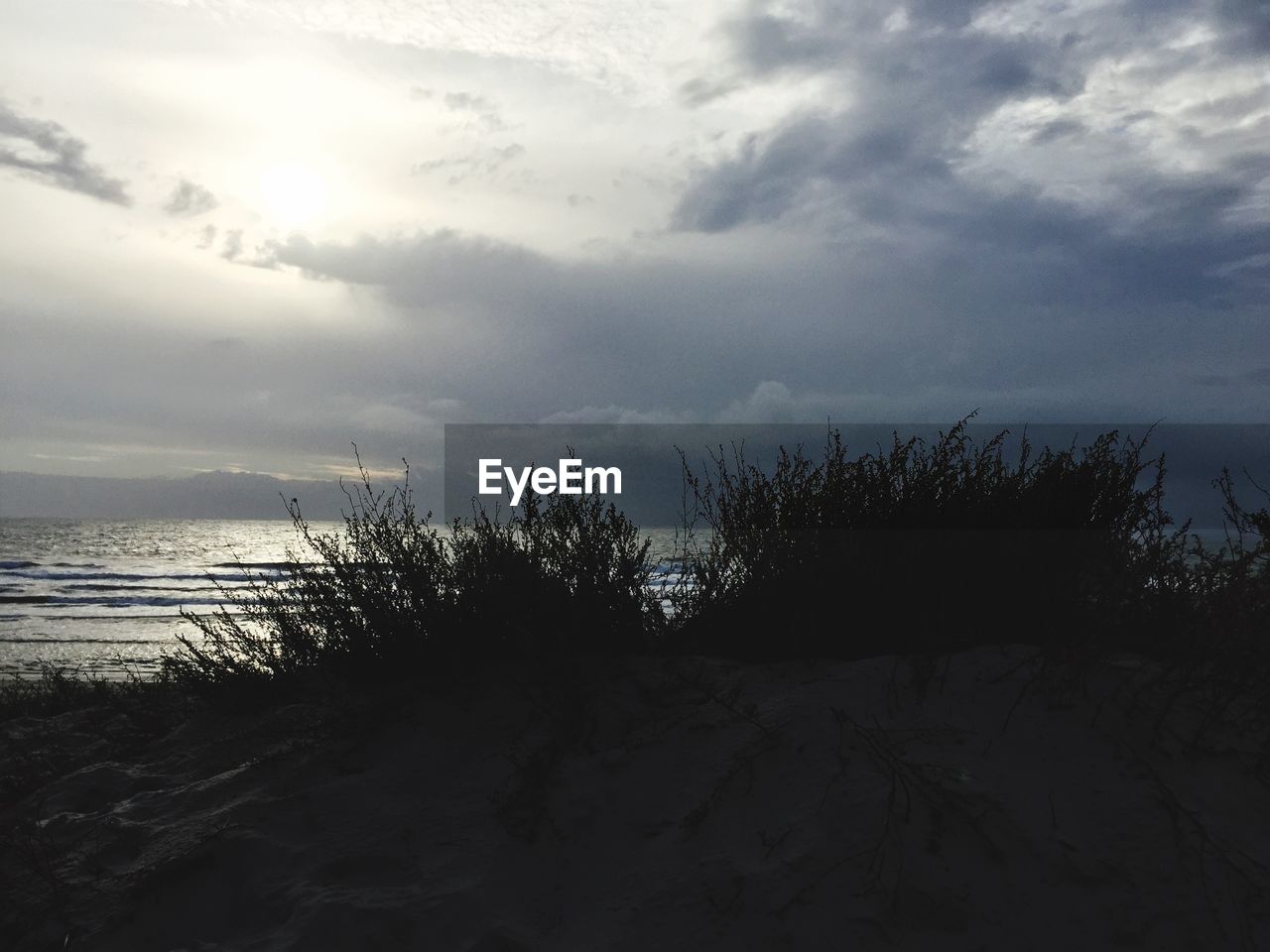 VIEW OF SEA AGAINST CLOUDY SKY