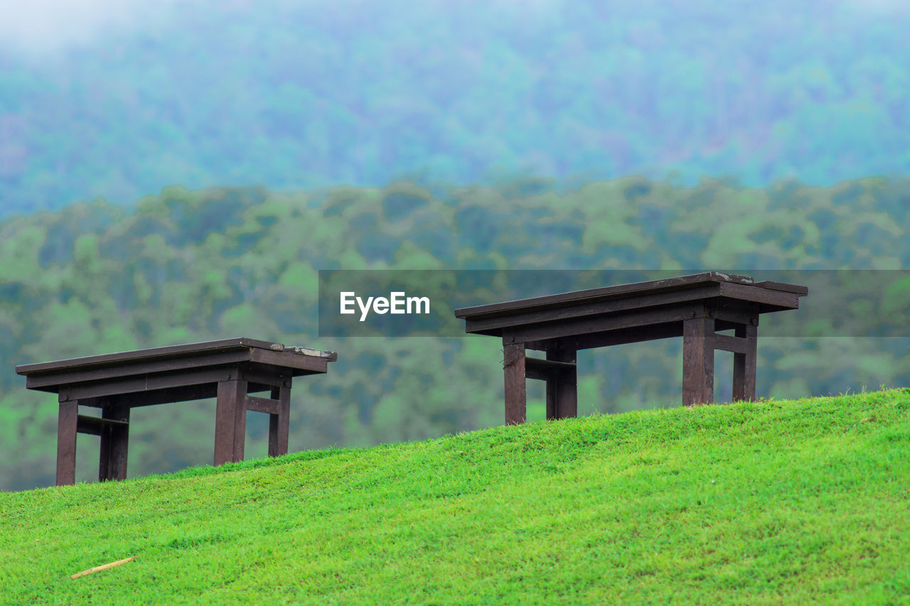 BUILT STRUCTURE ON FIELD AGAINST SKY