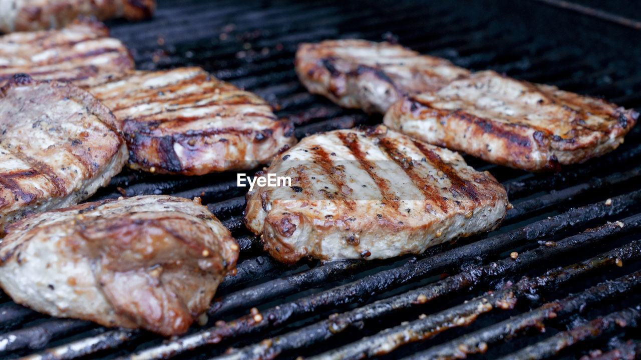 food, food and drink, barbecue, barbecue grill, grilled, meat, freshness, grilling, dish, no people, heat, fast food, close-up, cooking, breakfast sausage, high angle view, meal, still life, preparing food, roasting, steak, cuisine, outdoors