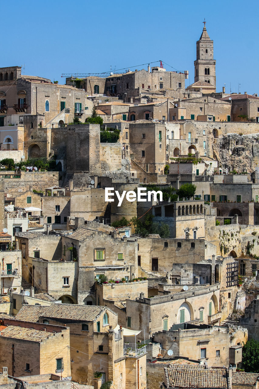 BUILDINGS IN TOWN AGAINST CLEAR SKY