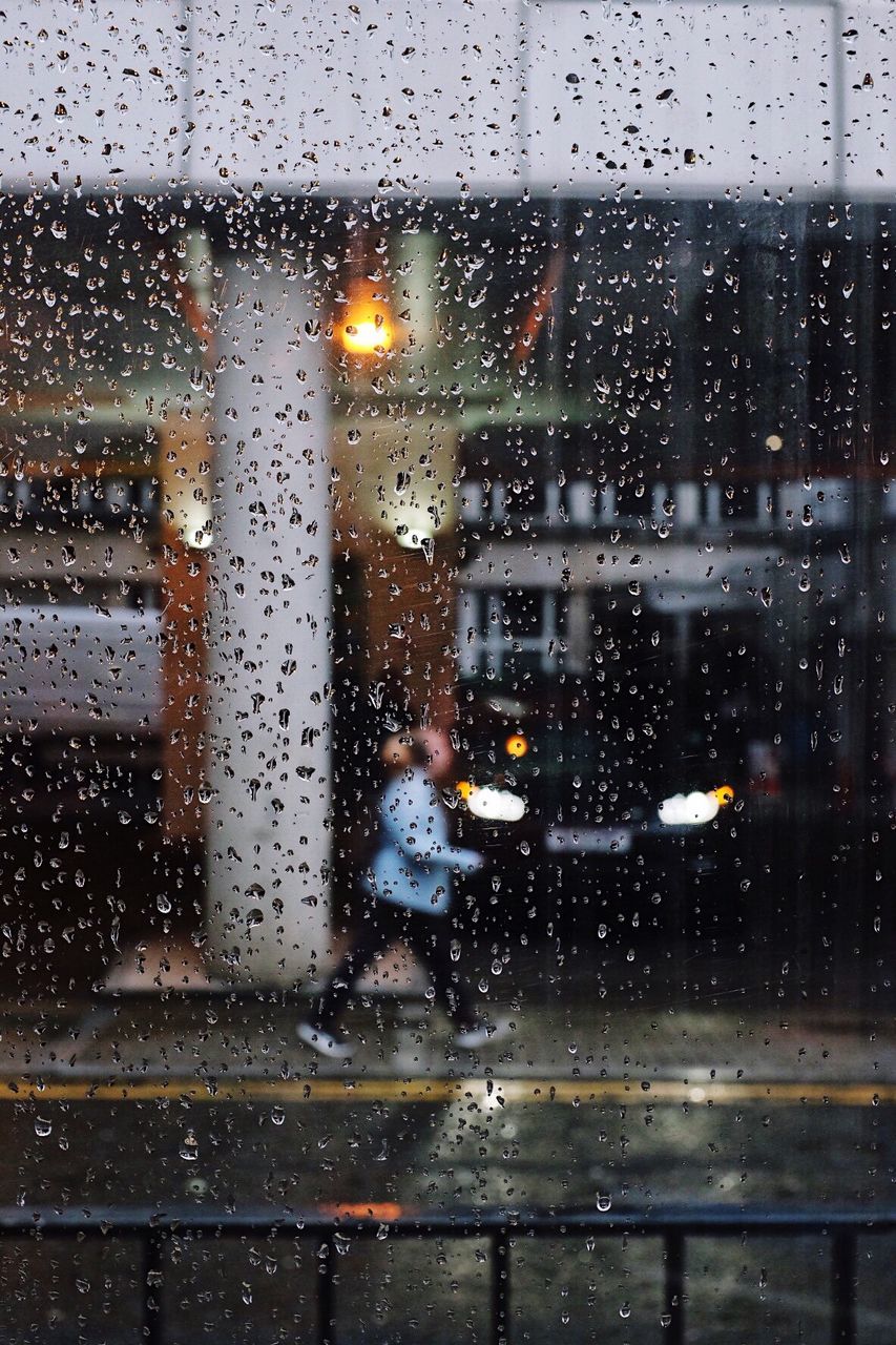 RAIN DROPS ON GLASS WINDOW