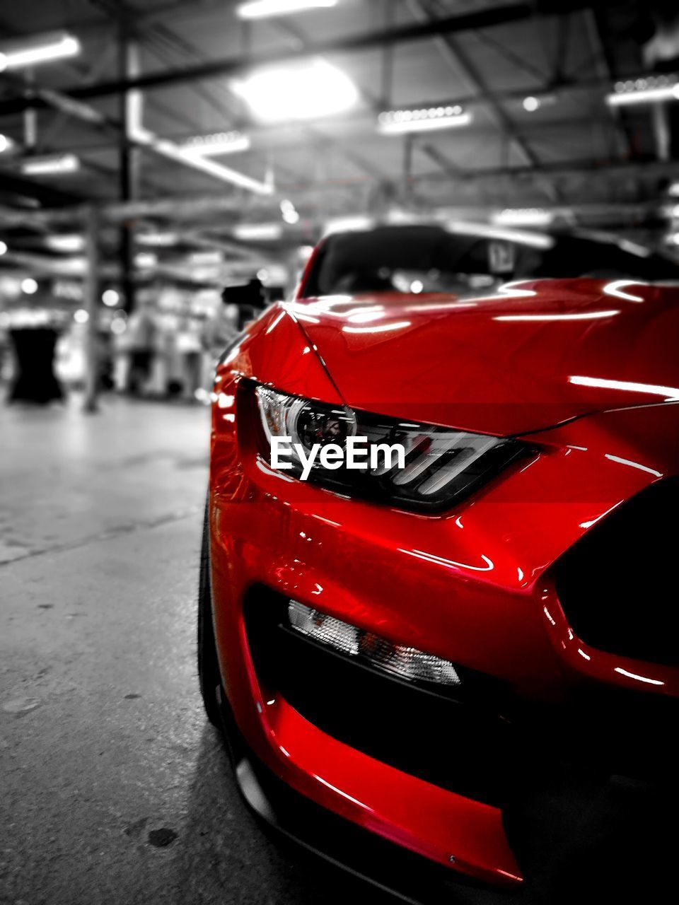 CLOSE-UP OF RED CAR ON TABLE