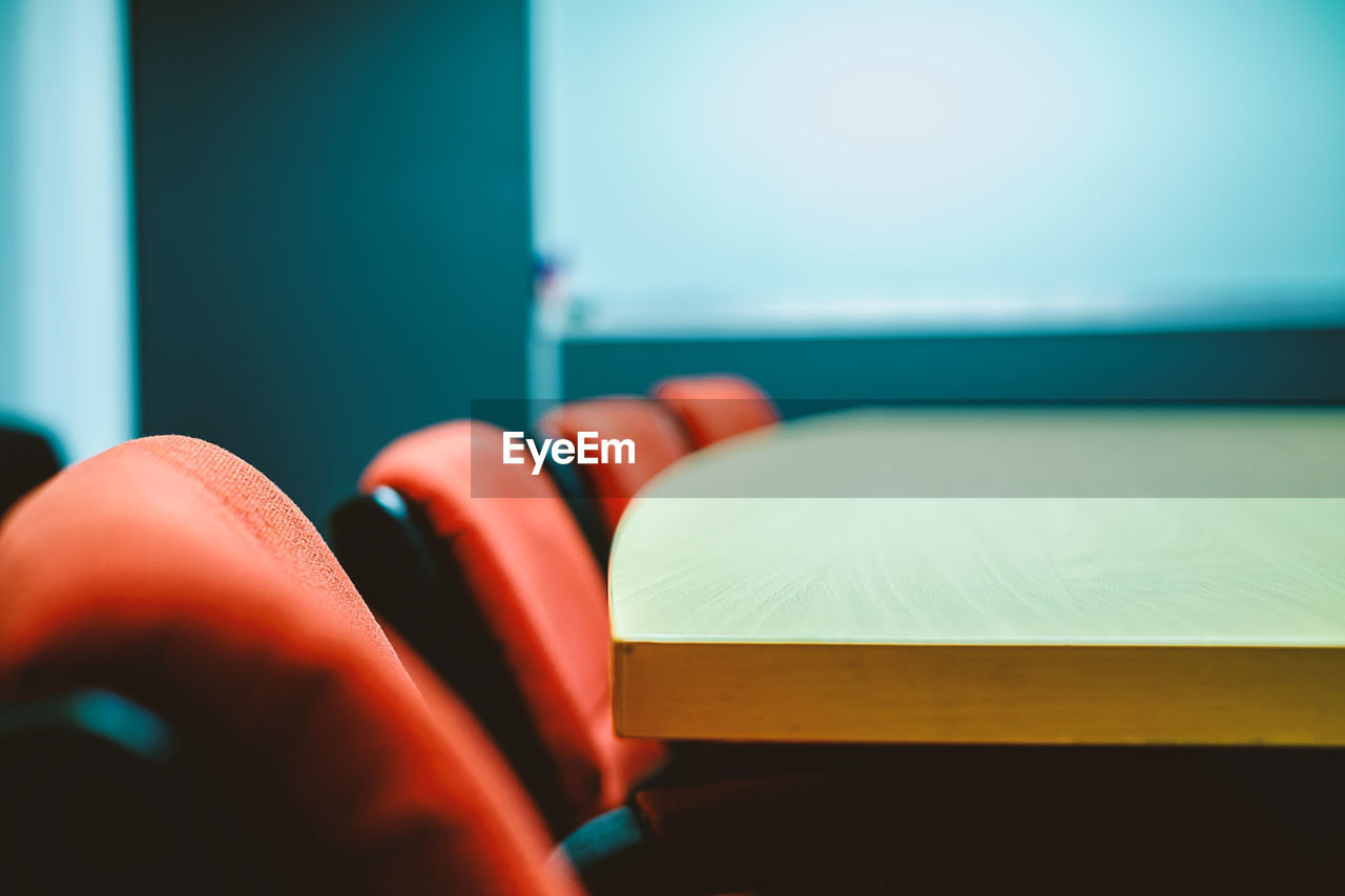 Close up of chairs and table in conference room