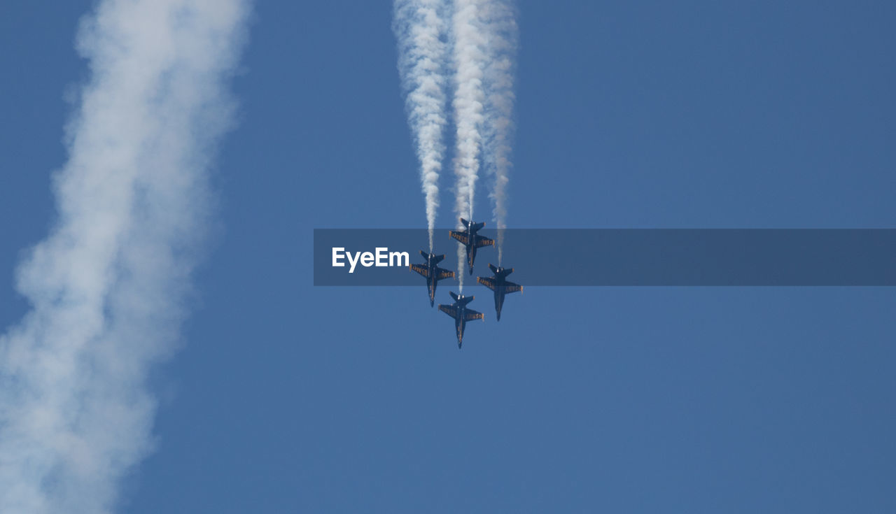 LOW ANGLE VIEW OF AIRPLANE AGAINST SKY