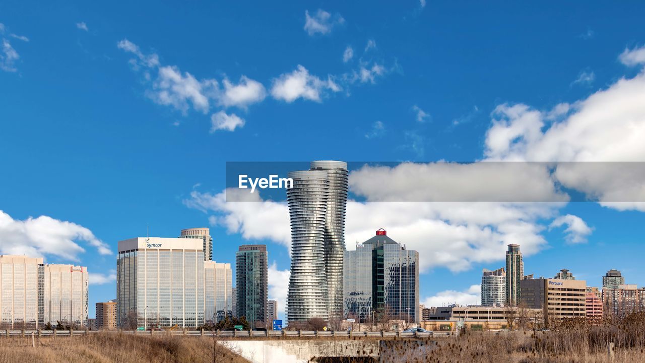 MISSISSAUGA, CANADA - MARCH 30, 2018: Beautiful Panoramic View of the Absolute World Residential twin tower buildings in the city Absolute Towers Mississauga, Canada Toronto Architecture Blue Building Building Exterior Built Structure City Cityscape Cloud - Sky Day Financial District  Landscape Modern Nature No People Office Office Building Exterior Outdoors Sky Skyscraper Tall - High Tower Urban Skyline