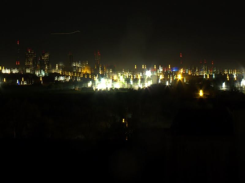 VIEW OF ILLUMINATED CITY AT NIGHT