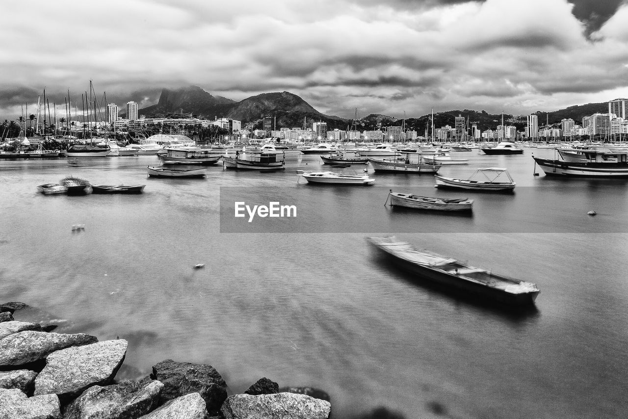 Boats moored at harbor