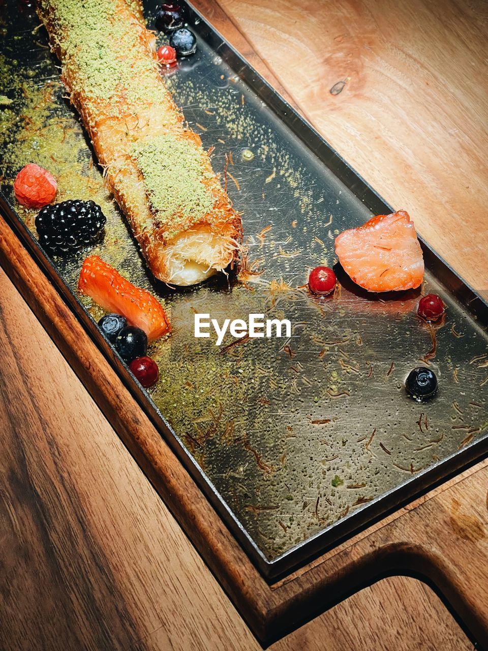 food, wood, food and drink, high angle view, freshness, table, cutting board, no people, healthy eating, indoors, still life, red, fruit, art, wellbeing, sushi, baked, produce