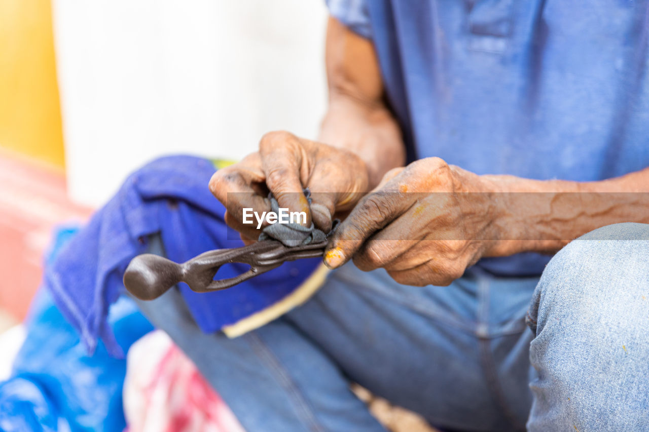 midsection of doctor examining patient at clinic