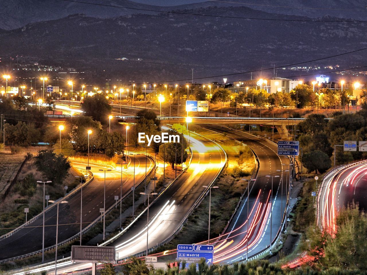 High angle view of light trails on highway at night