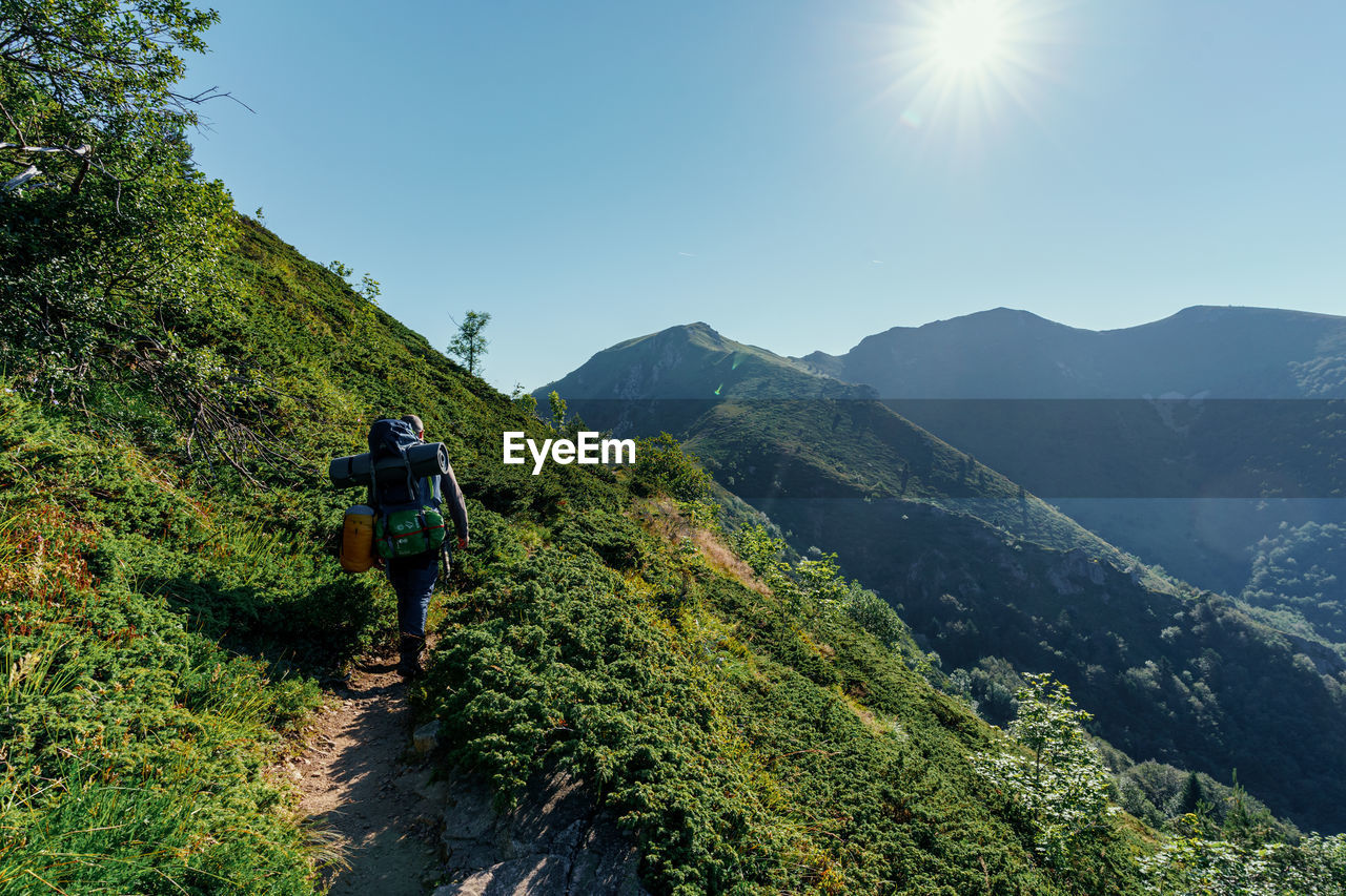 Rear view of man hiking in the mountain. shot in stara planina, bulgaria.