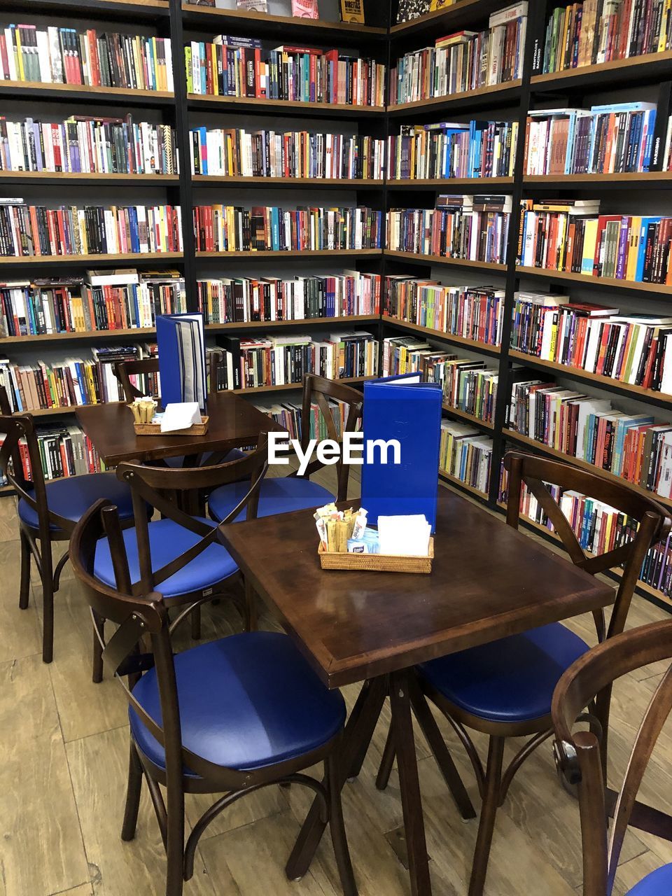 EMPTY CHAIRS AND TABLE IN SHELF