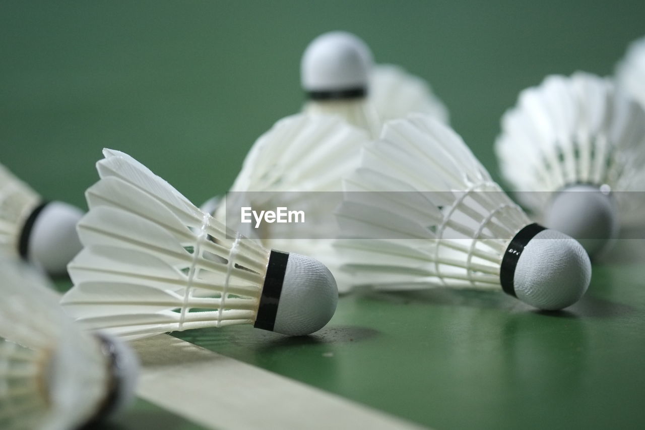 Close-up of shuttlecocks on table