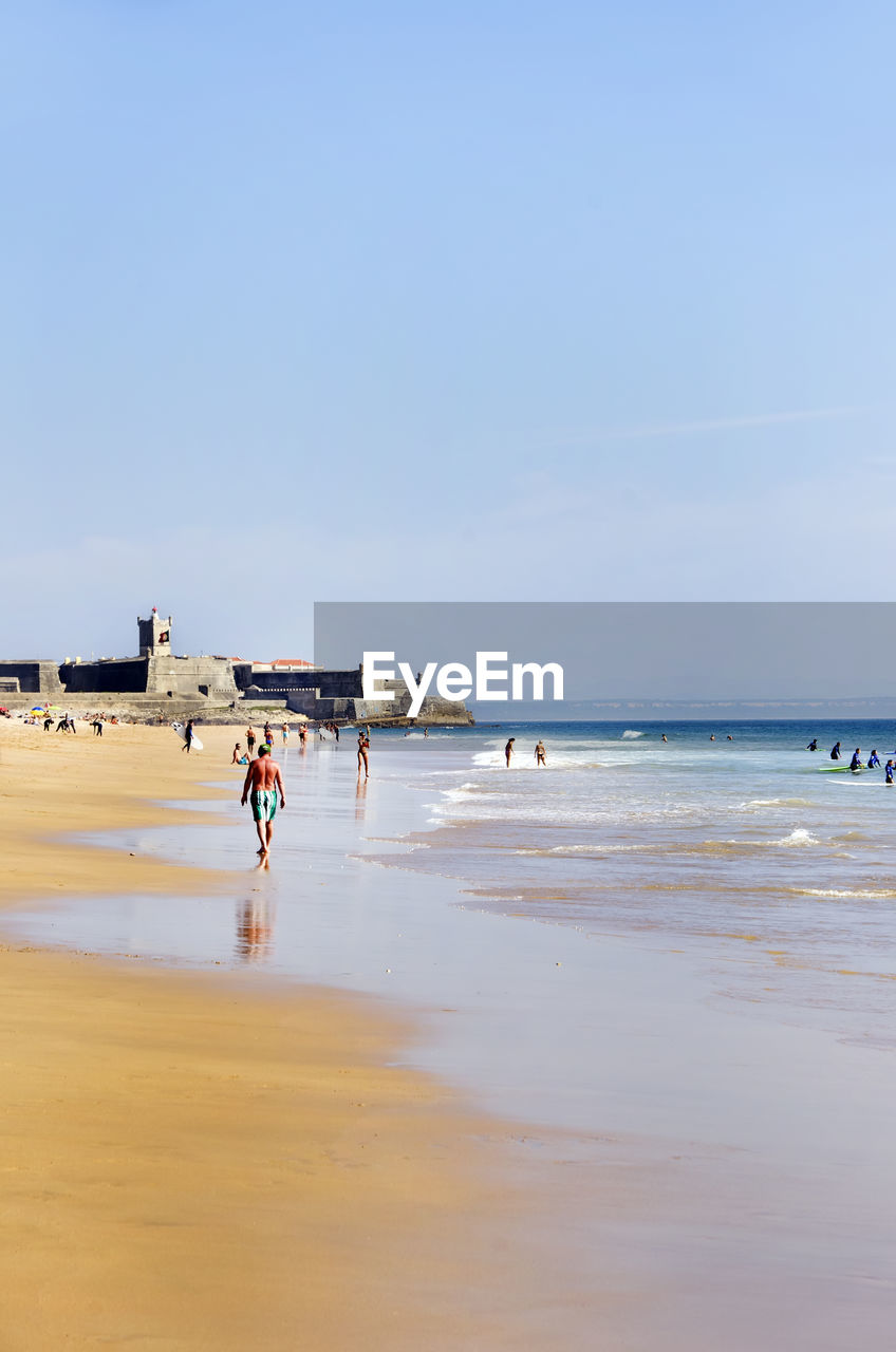 Scenic view of beach against clear sky