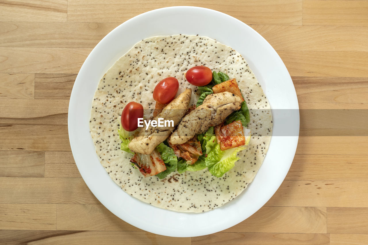 High angle view of flatbread in plate on table