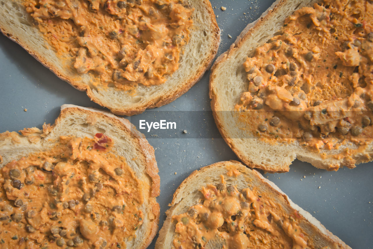 Plate of bread with lentil salad spread. simple vegetarian or vegan lunch.