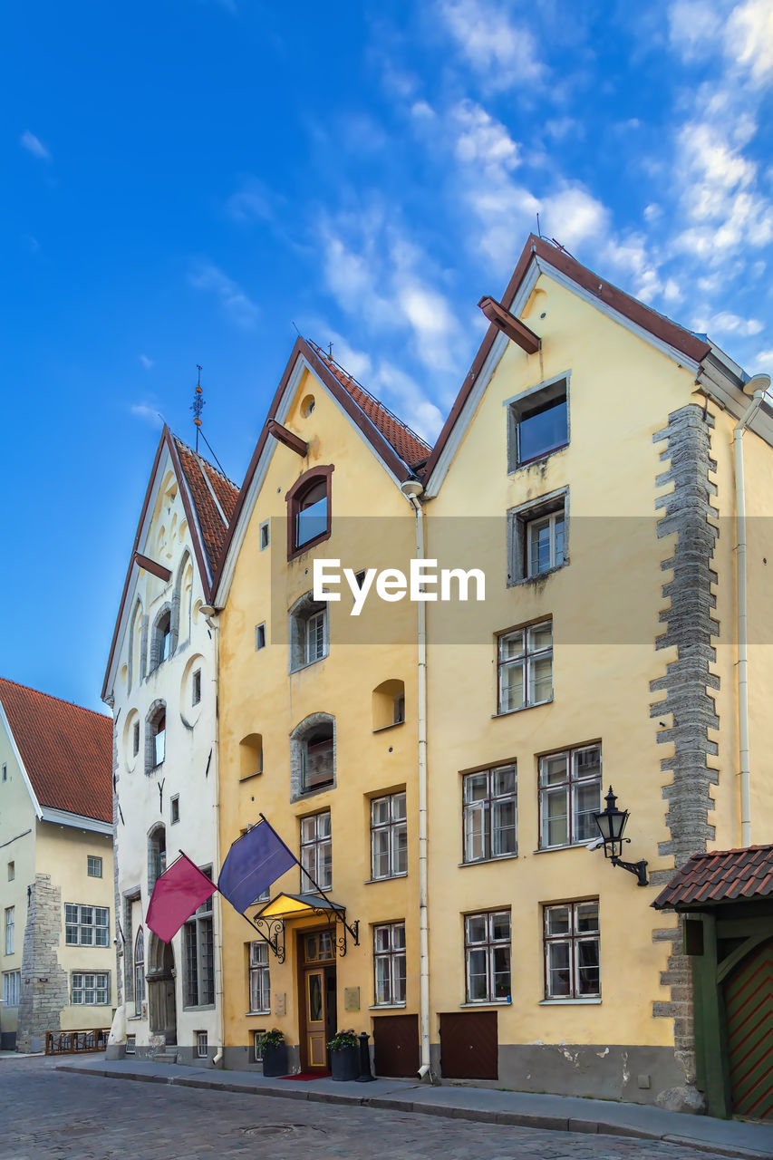 Street in tallinn with historical houses three sisters, estonia