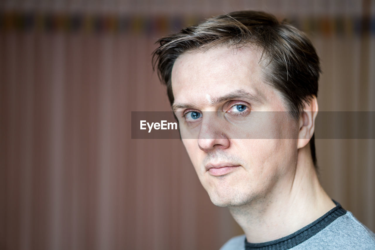 Close-up portrait of man with blue eyes