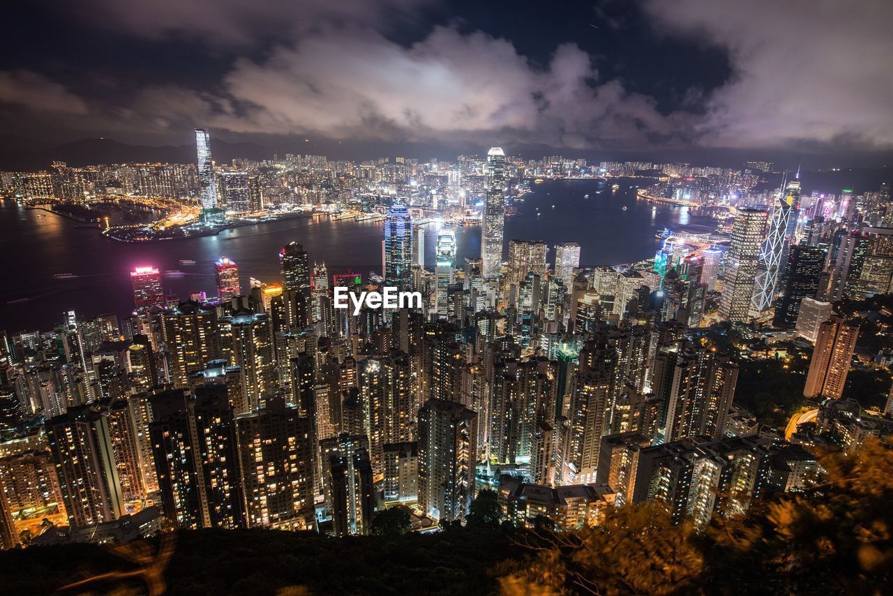 High angle view of illuminated city buildings at night