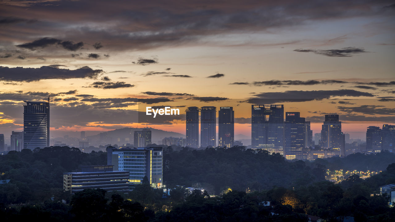 CITYSCAPE AGAINST SKY DURING SUNSET