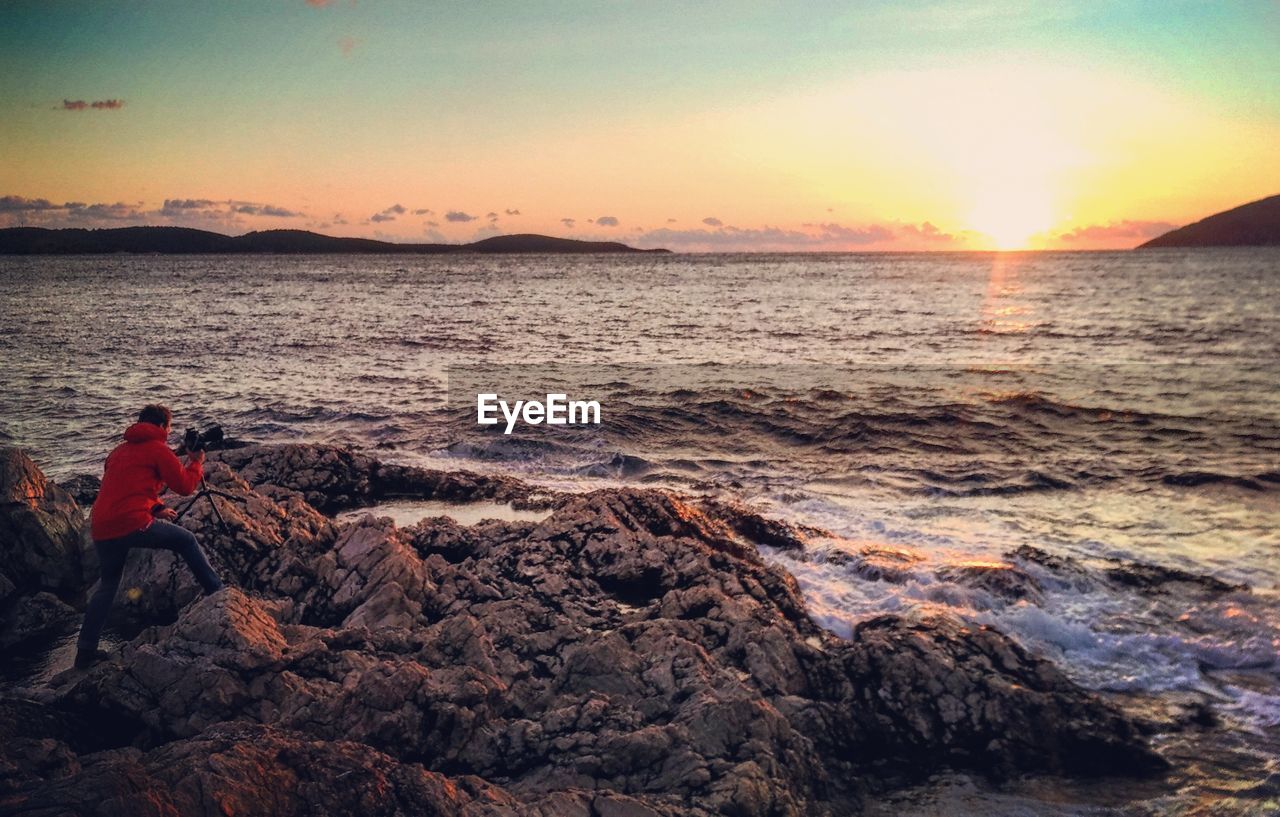 SCENIC VIEW OF SEA DURING SUNSET