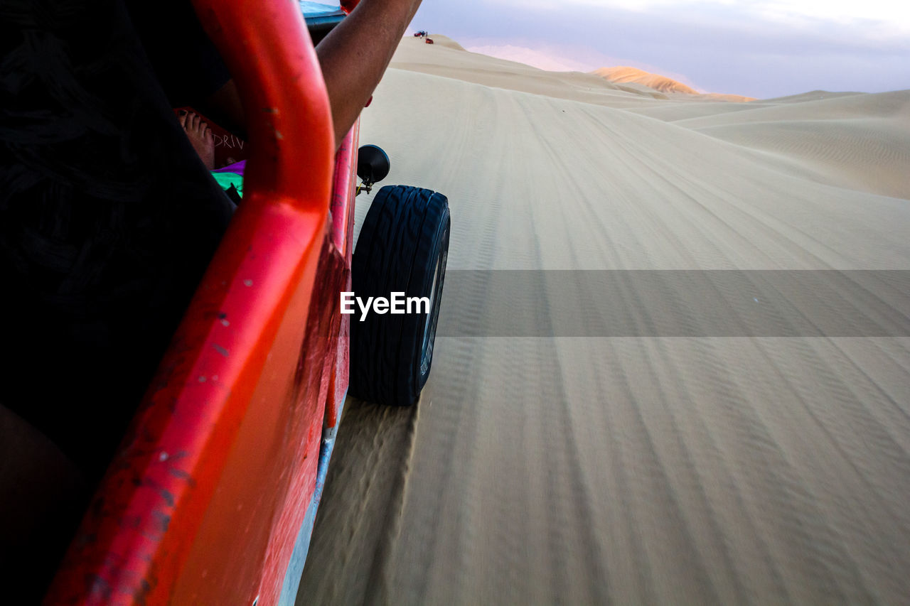 Off-road vehicle on sand at desert