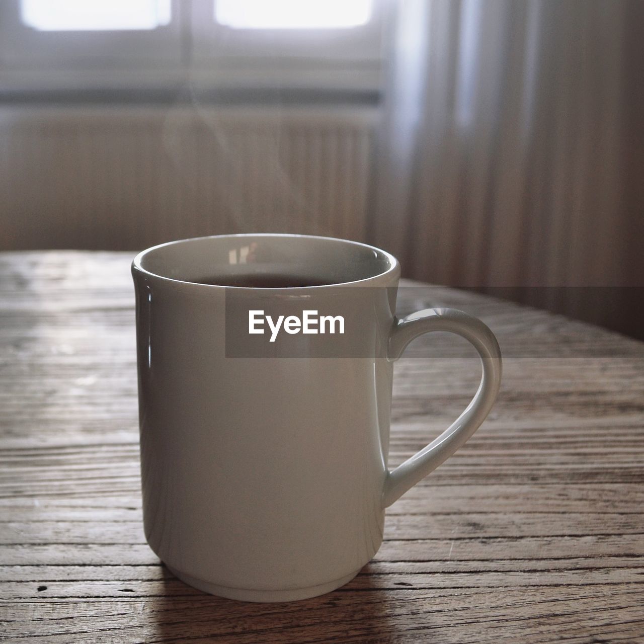 CLOSE-UP OF CUP OF TEA ON TABLE