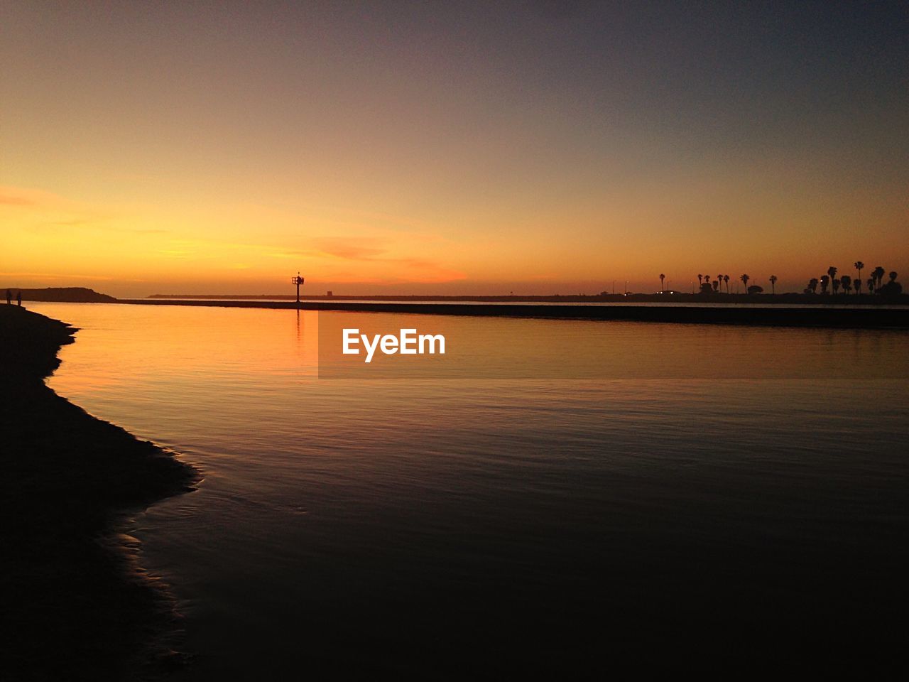 Scenic view of sea at sunset