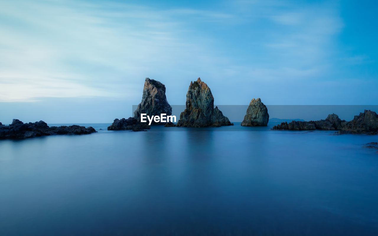 Scenic view of sea against blue sky