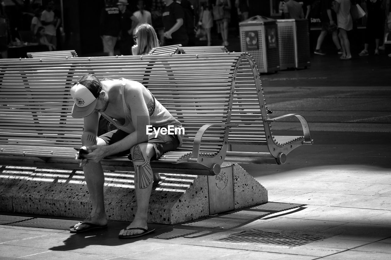 MAN WORKING WITH SHOPPING CART