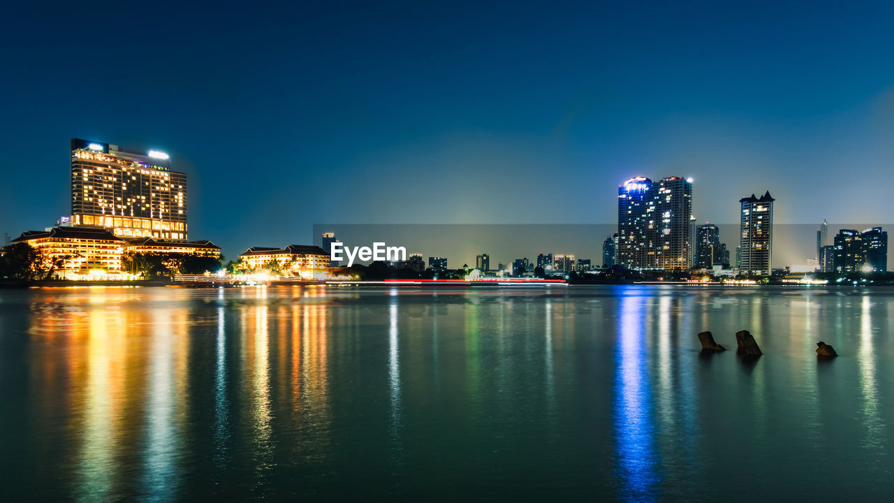 Bangkok's evening business city in thailand and the river is the center.