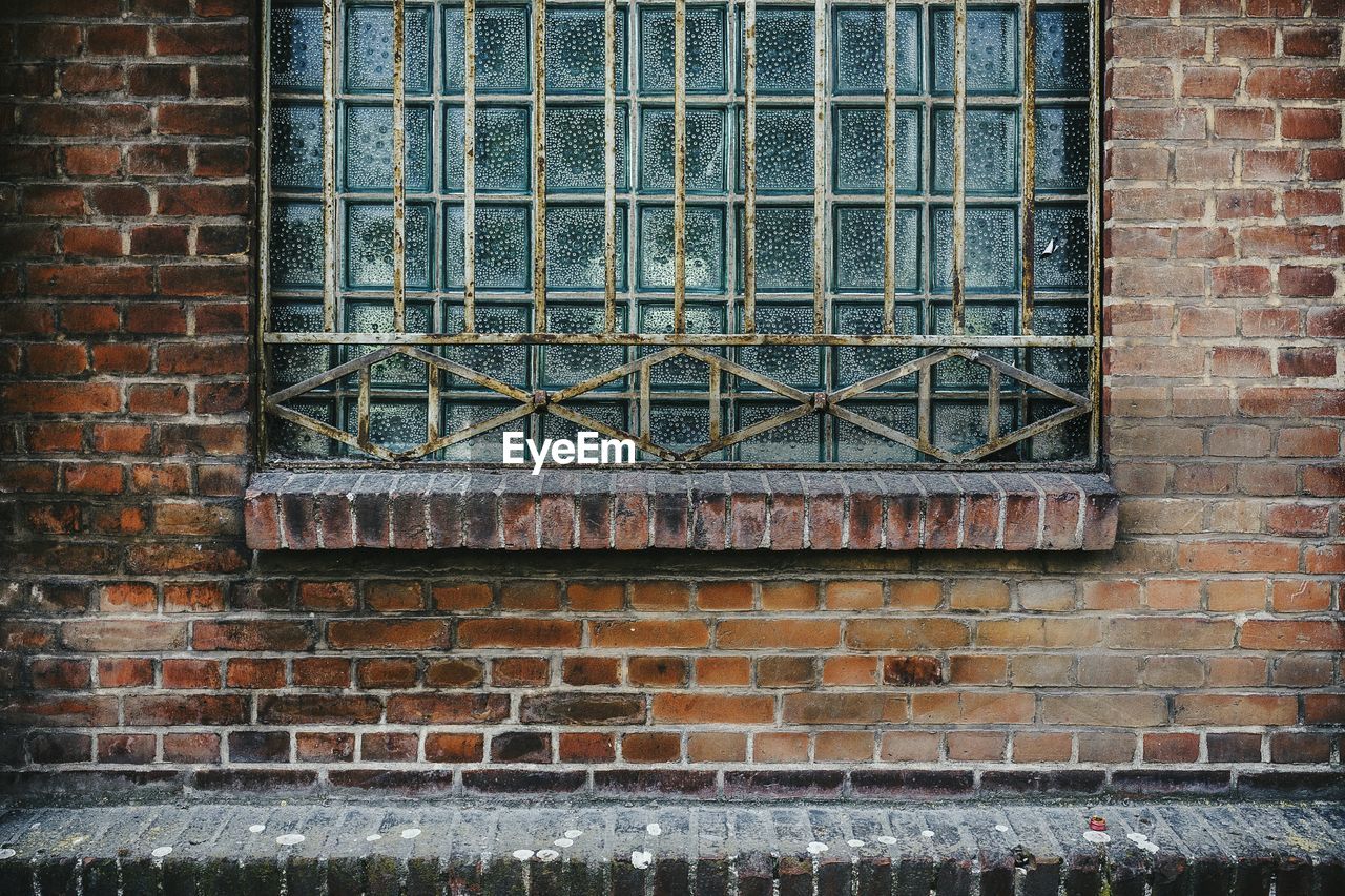 Window on brick wall of old building