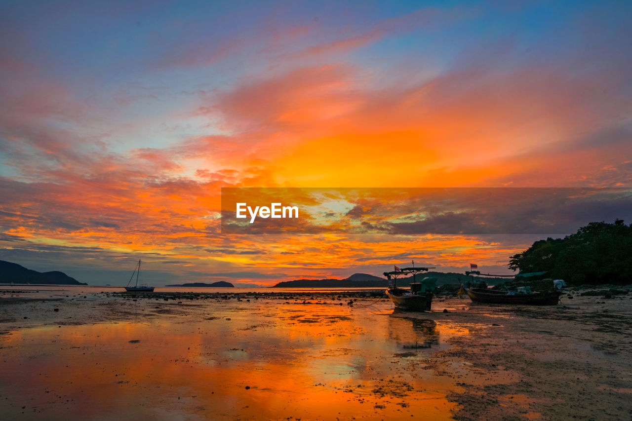 Scenic view of beach against sky during sunset