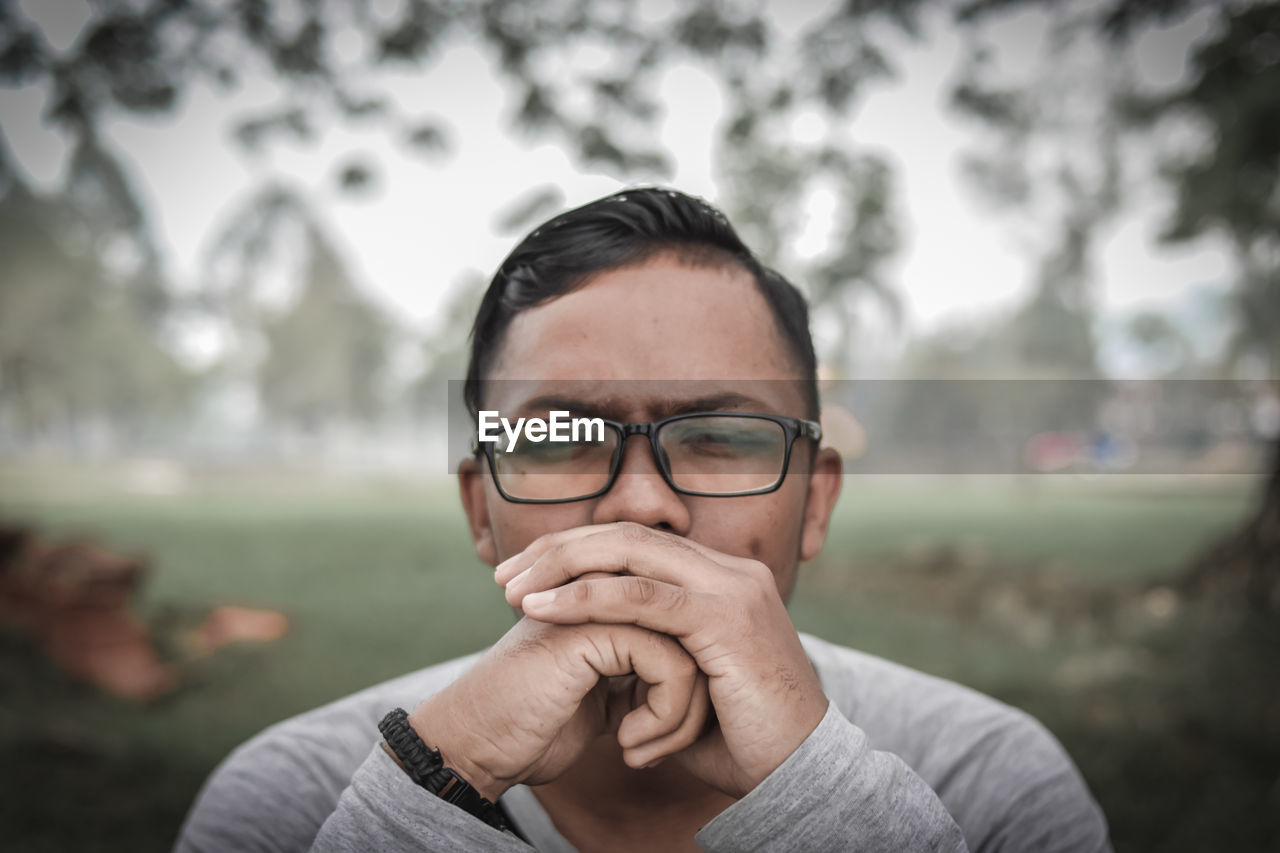 Portrait of man wearing eyeglasses