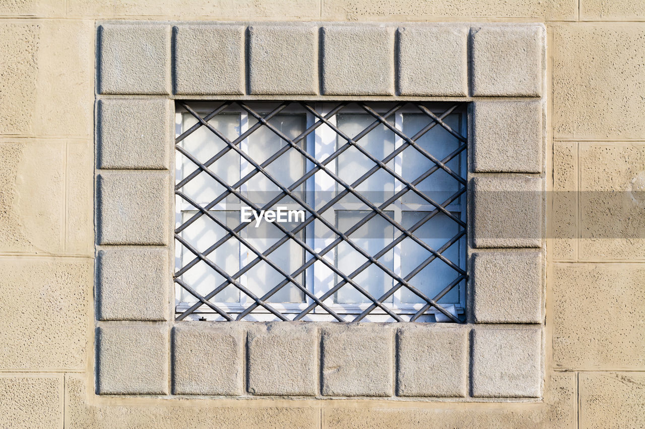 Close-up of metal grate on window