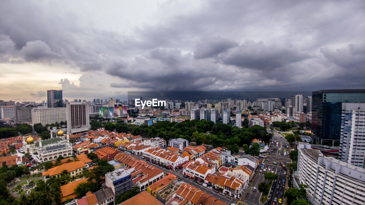 High angle view of buildings in city against sky