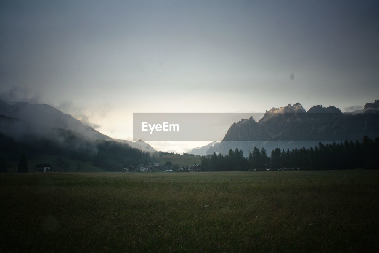 Scenic view of landscape and mountains against sky