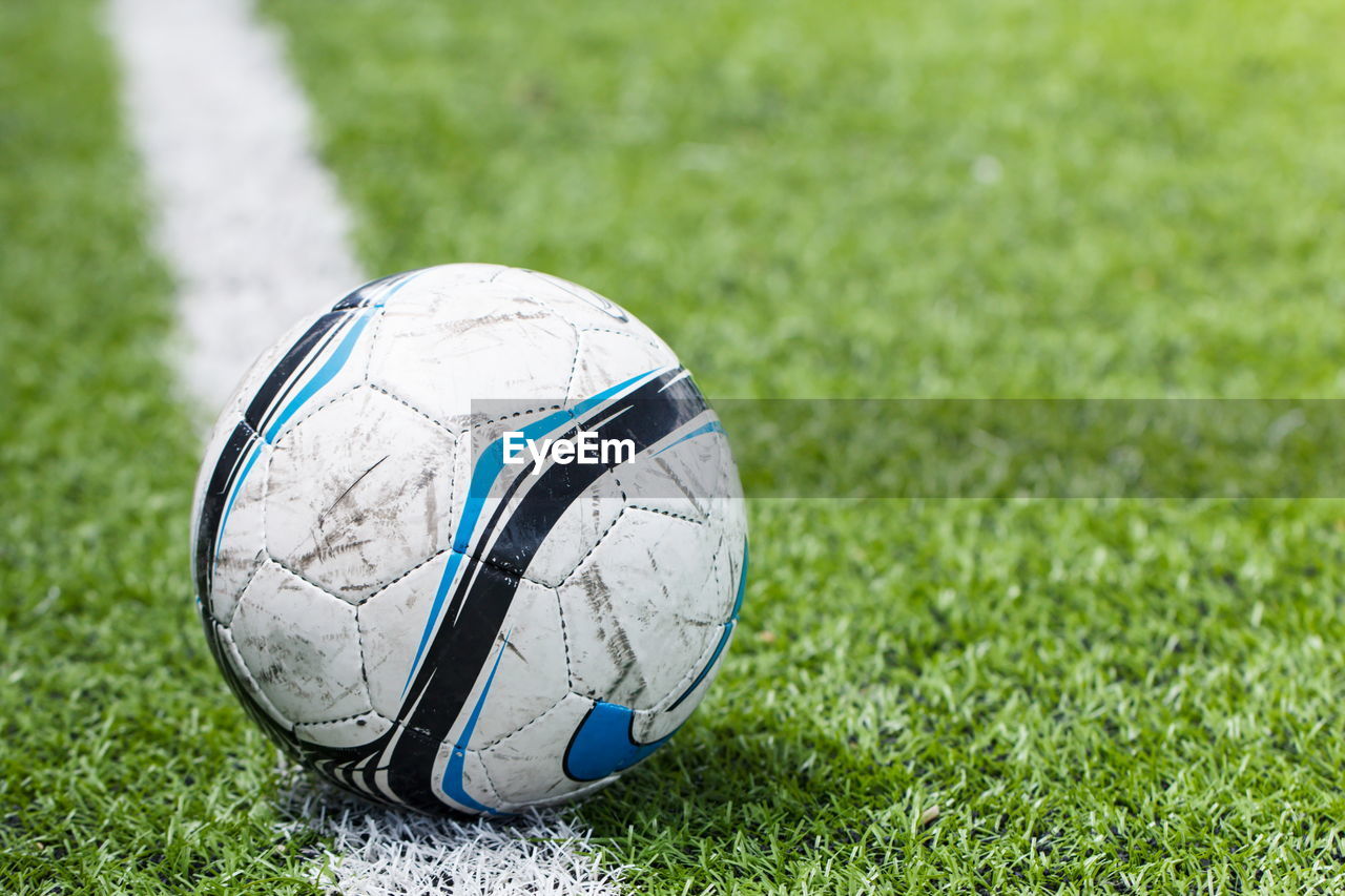 Close-up of soccer ball on field