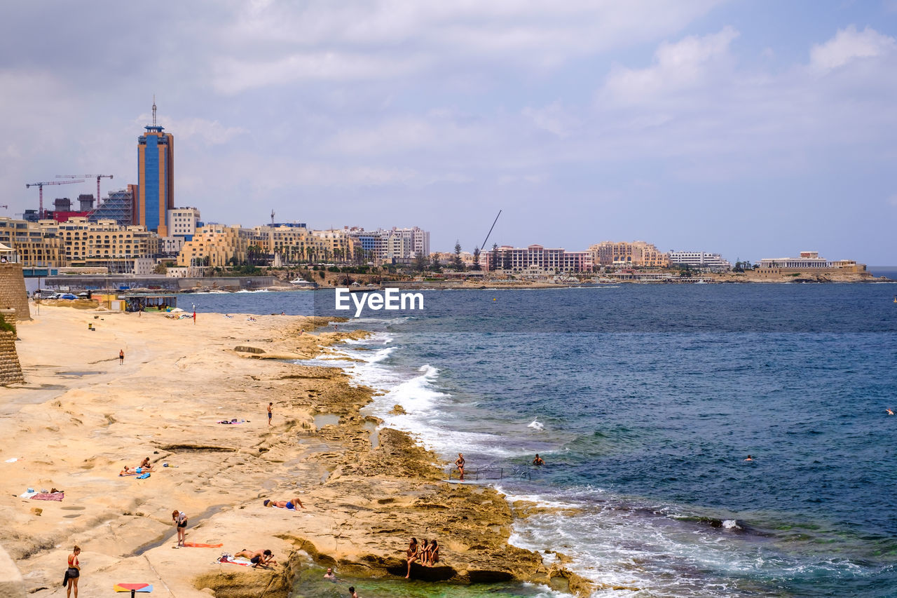 VIEW OF BEACH AGAINST BUILDINGS