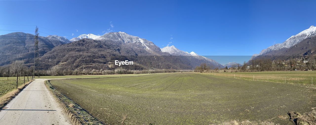 SCENIC VIEW OF LANDSCAPE AGAINST BLUE SKY