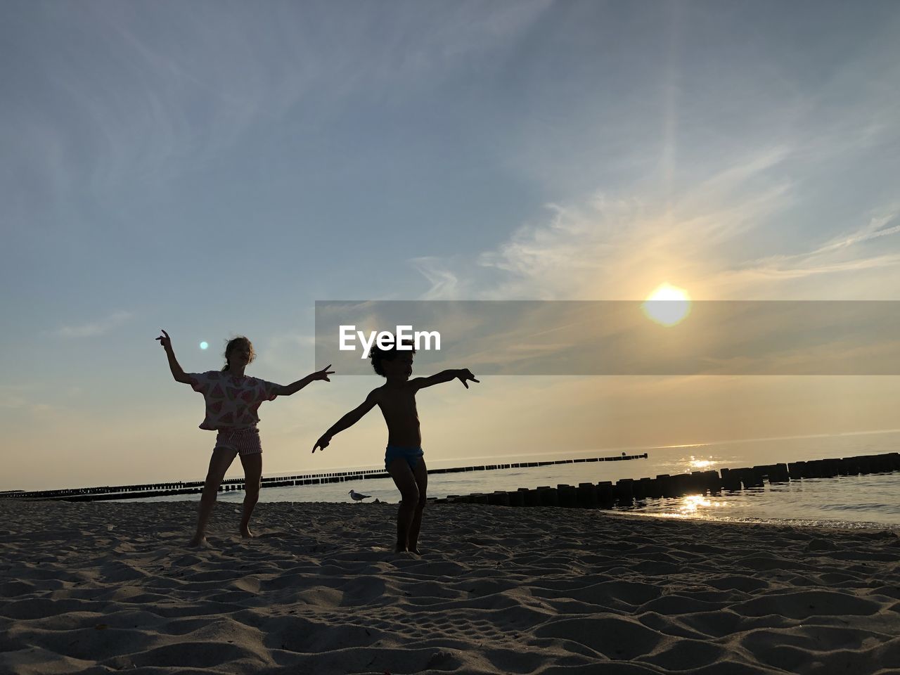 PEOPLE AT BEACH DURING SUNSET