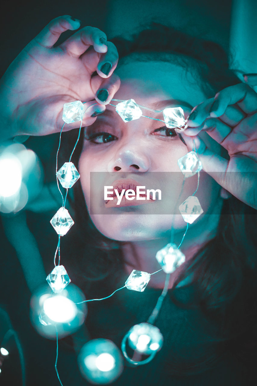 CLOSE-UP PORTRAIT OF A TEENAGE GIRL WITH BLUE EYES