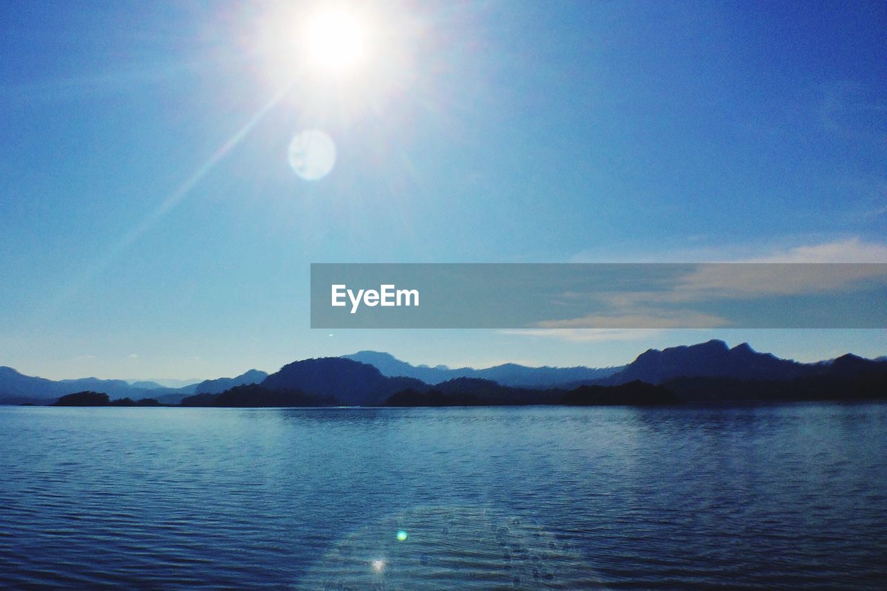 SCENIC VIEW OF LAKE AGAINST MOUNTAINS