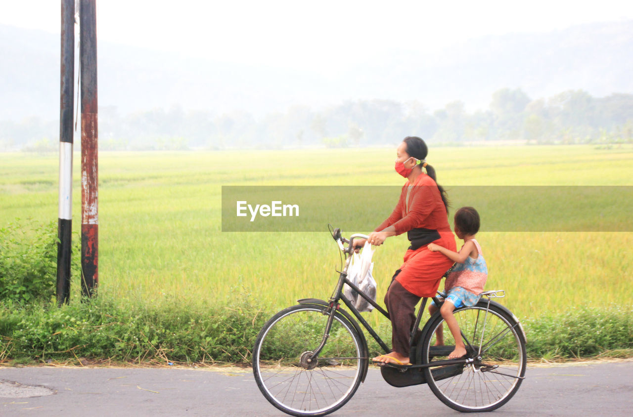 A mother takes her child to school in the morning