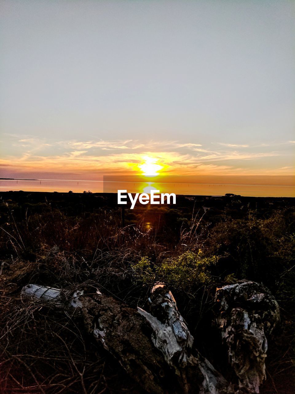 SCENIC VIEW OF SUNSET OVER LANDSCAPE